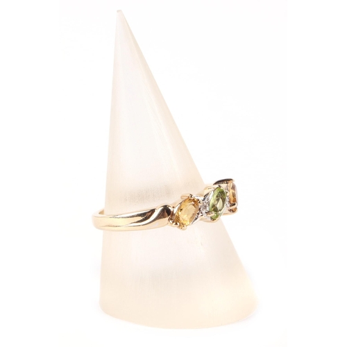 612 - A 9ct gold peridot, citrine and diamond ring, approx UK size N, 2.6g.