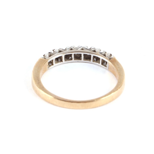 638 - A 9ct gold seven-stone diamond ring, approx UK size 'Q', 3g.