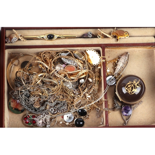 641 - A quantity of costume jewellery to include a rolled gold bangle; necklaces and brooches.