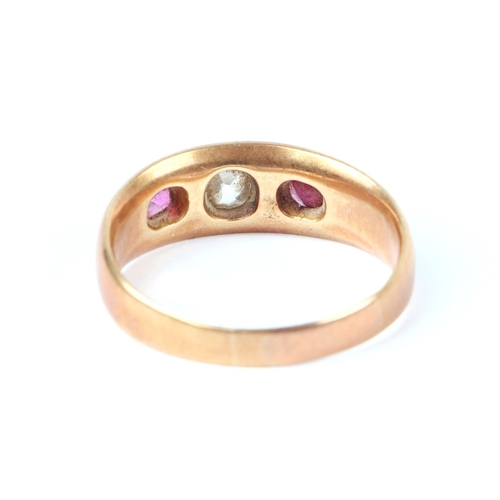 647 - A gold diamond and ruby three-stone gypsy ring, the central diamond 3mm by 4mm, indistinct Sheffield... 