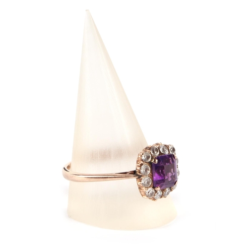 648 - A 9ct gold amethyst and white stone cluster ring, approx. UK size T, 3.5g.