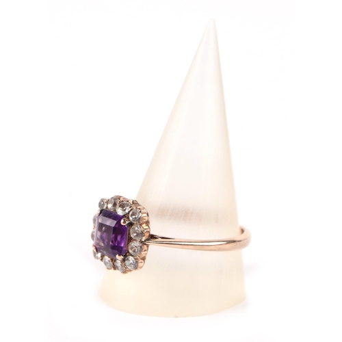 648 - A 9ct gold amethyst and white stone cluster ring, approx. UK size T, 3.5g.