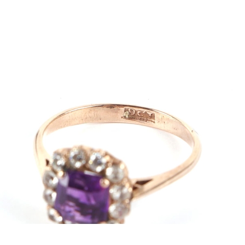 648 - A 9ct gold amethyst and white stone cluster ring, approx. UK size T, 3.5g.