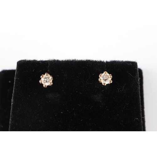 649 - A pair of 18ct yellow gold diamond stud earrings, diamonds approx 3mm diameter.