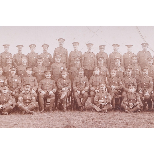 65 - Three early 20th century Dorset Regimental photographs, each 29 by 21cms, all mounted but unframed (... 