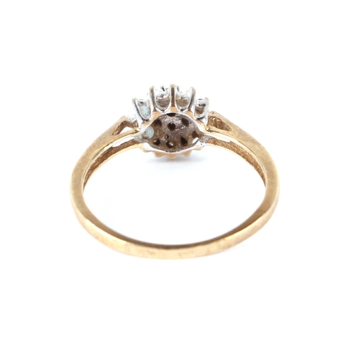 656 - A 9ct gold diamond cluster ring, approx UK size, P, 2g.