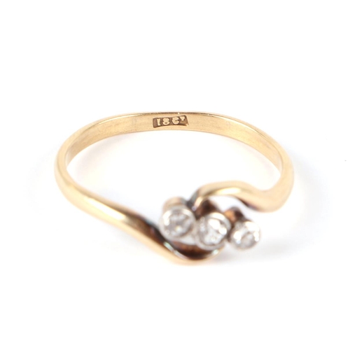 658 - An 18ct gold three-stone diamond ring, approx UK size R, 2.5g.