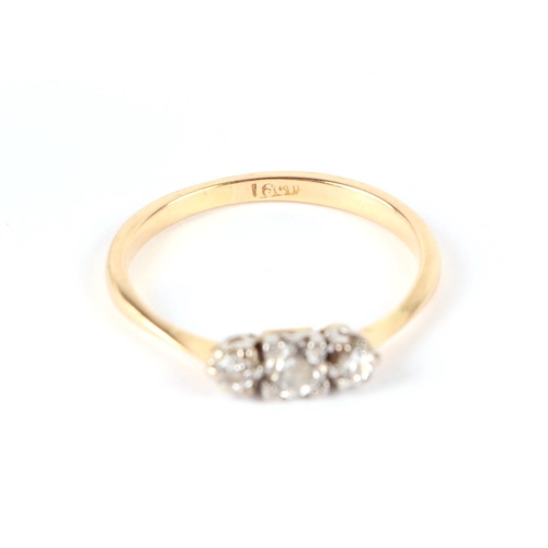 660 - An 18ct gold three-stone diamond ring, approx UK size P, 2.4g.