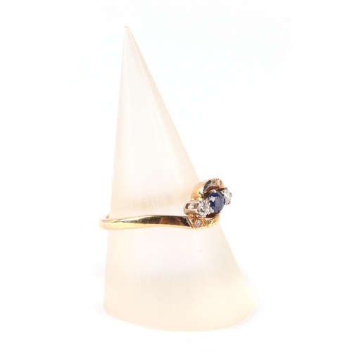 662 - An 18ct gold diamond and sapphire ring, approx UK size N, 3.1g.