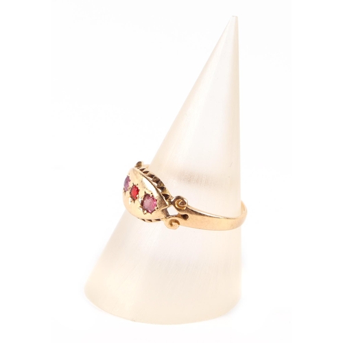 665 - An Edwardian 18ct gold three-stone ruby ring, approx UK size M, 2g.