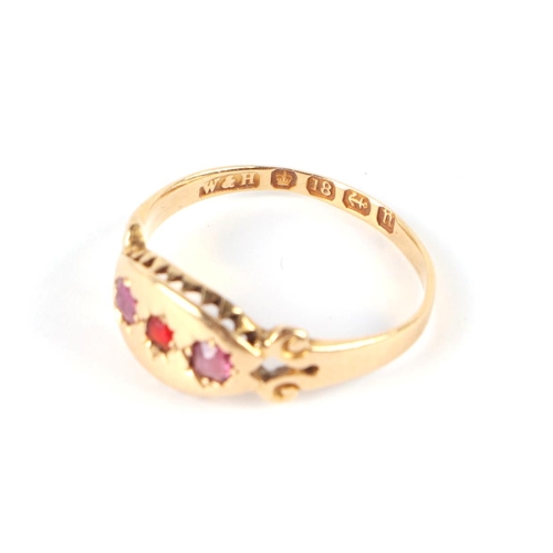 665 - An Edwardian 18ct gold three-stone ruby ring, approx UK size M, 2g.