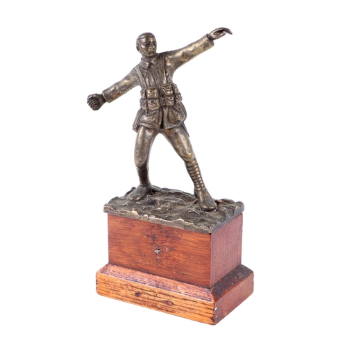 67 - A bronze sculpture by Sydney Wilkinson depicting a WWI soldier throwing a grenade, signed, 12cms hig... 