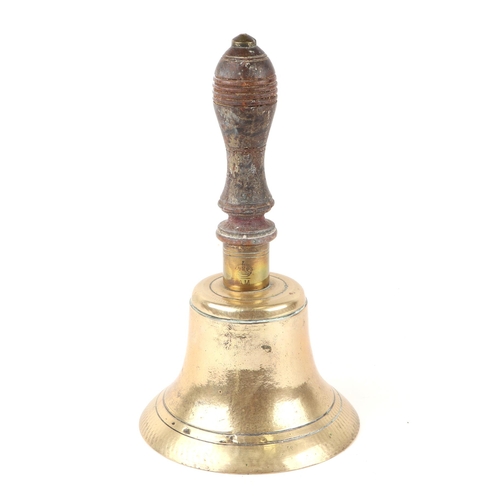 68 - An Air Ministry brass hand bell with turned treen handle and Air Ministry stamp, 25cms high.