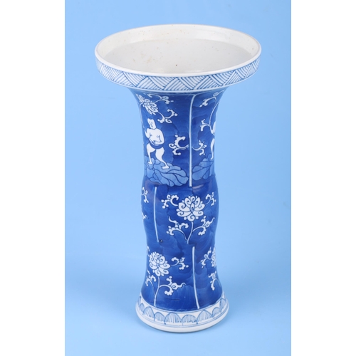 689 - A Chinese blue & white Gu vase decorated with figures wand foliate scrolls, 23cms high.