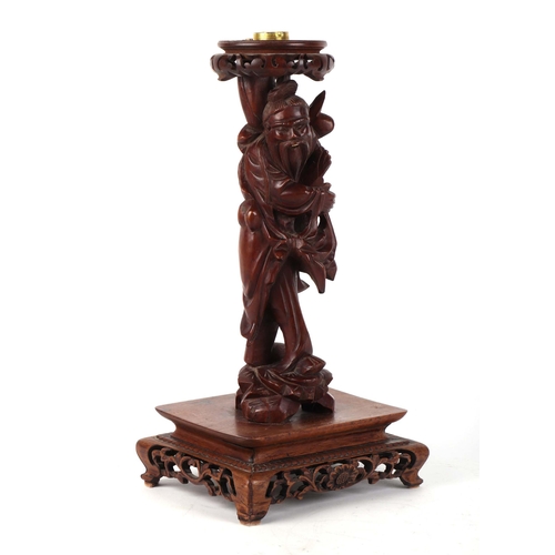 708 - A Chinese root wood figural table lamp, 39cms high.