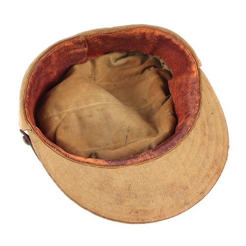 71 - A WWII Woman's Auxiliary Corp (India) cloth peaked cap with WAC cap badge.