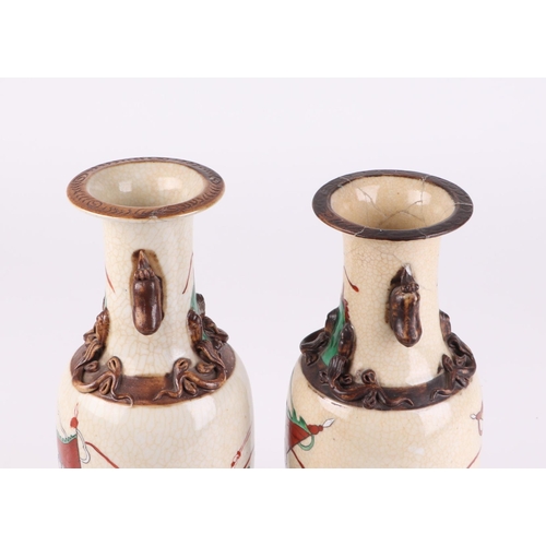 718 - A pair of Chinese crackle glaze baluster vases decorated with warriors on horseback, character mark ... 