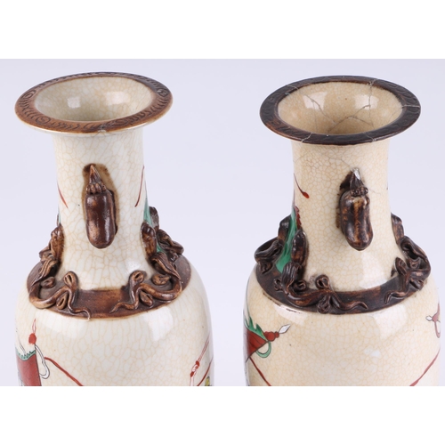 718 - A pair of Chinese crackle glaze baluster vases decorated with warriors on horseback, character mark ... 