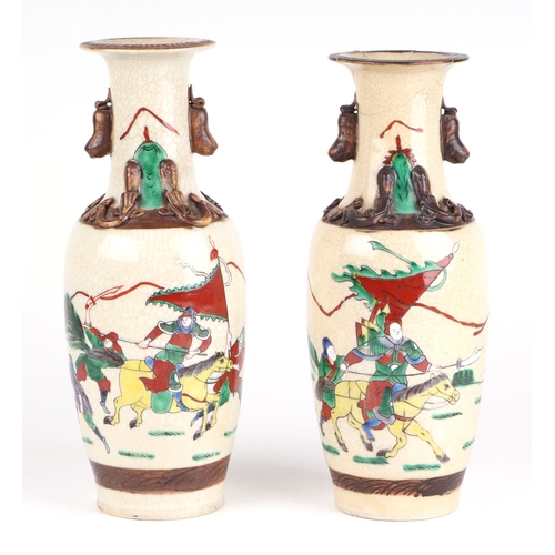 718 - A pair of Chinese crackle glaze baluster vases decorated with warriors on horseback, character mark ... 