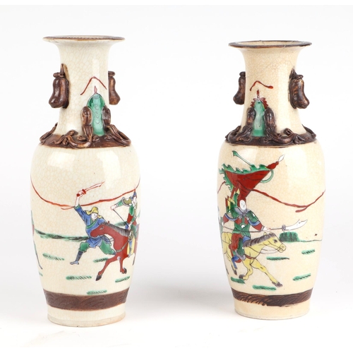 718 - A pair of Chinese crackle glaze baluster vases decorated with warriors on horseback, character mark ... 