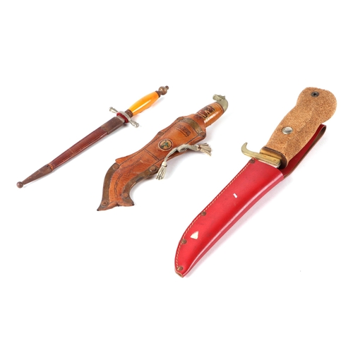 72 - A Milbro Kampa amphibian sheath knife with cork handle; together with a Finnish sheath knife; and a ... 