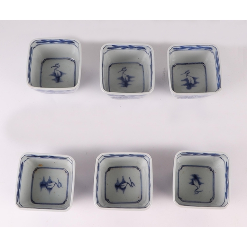 724 - A quantity of Japanese blue & white dishes of various forms decorated with landscapes, the largest 1... 