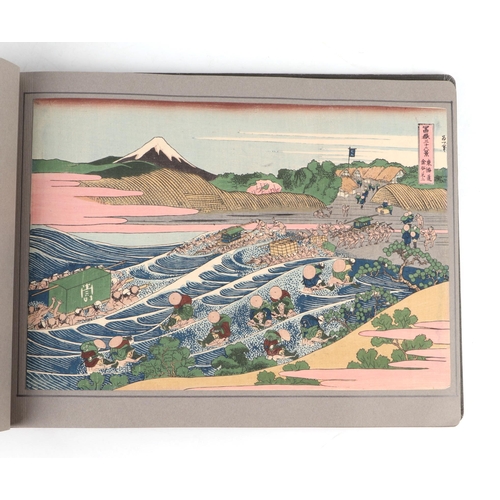 735 - After Katsushika Hokusai (Japanese 1760-1849) - a folio containing thirty one reproduction woodblock... 