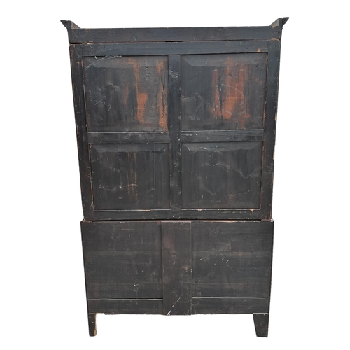 737 - A Korean floor standing cabinet with two small frieze drawers above three cupboards, 103cms wide.