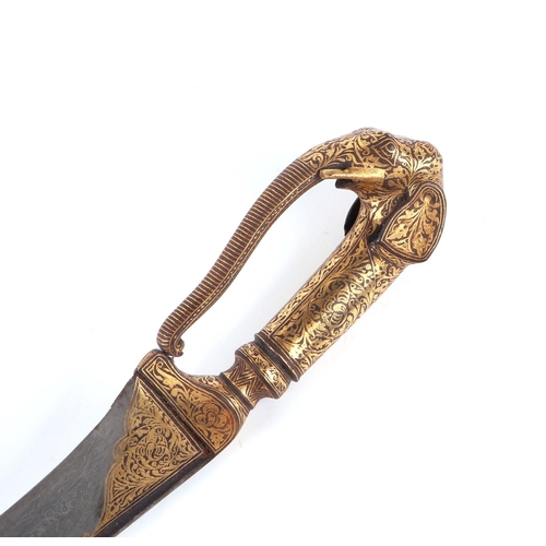 74 - An Indo-Persian Koftgari dagger in a leather scabbard with elephant head handle and watered steel bl... 