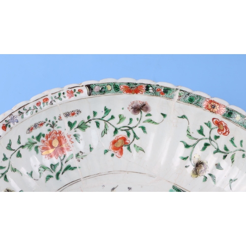 747 - A large Chinese famille vert oval bowl decorated with exotic birds and flowers, 40cm wide. Condition... 