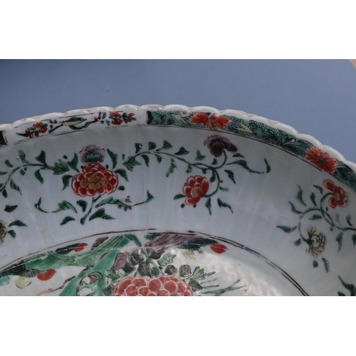 747 - A large Chinese famille vert oval bowl decorated with exotic birds and flowers, 40cm wide. Condition... 