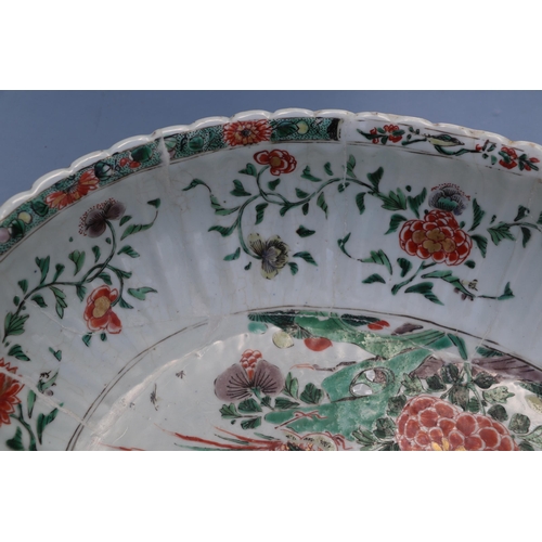 747 - A large Chinese famille vert oval bowl decorated with exotic birds and flowers, 40cm wide. Condition... 