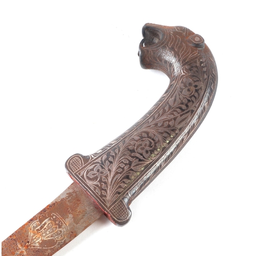 75 - An Indo-Persian dagger with white metal inlay, the handle terminal in the form of a panther's head, ... 