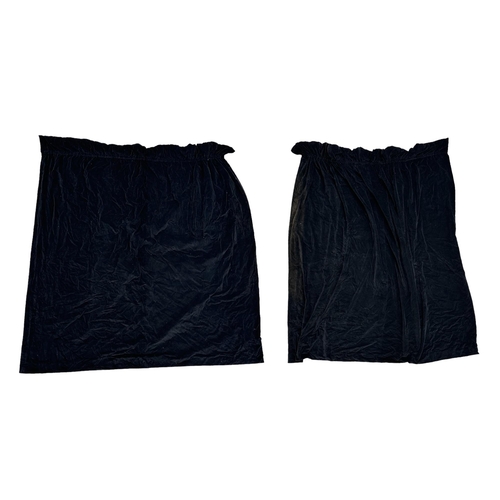 77 - A pair of black velvet interlined curtains, approx 120 width by 210cms depth (2).