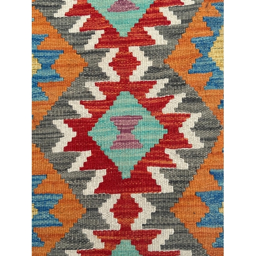 78 - A kilim runner with geometric repeating design on a multi coloured ground, 192 by 70cms.