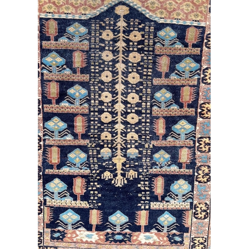 80 - A Persian hand knotted prayer rug with geometric design on a beige ground, 130 by 91cms.