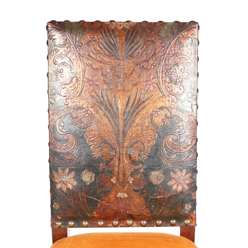 825 - A 17th century style occasional chair with tooled leather back and upholstered seat.