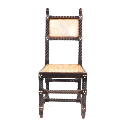 835 - An Anglo Indian walnut occasional chair with caned seat and back, on barley twist supports.