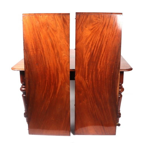 839 - A Victorian mahogany extending dining table, the rounded rectangular top inset with two extra leaves... 