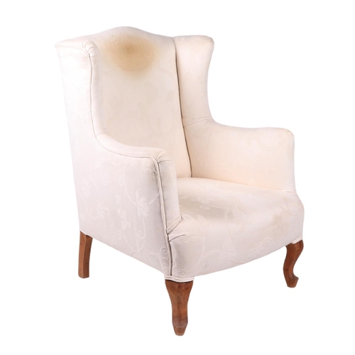 847 - A pair of George III style wingback upholstered armchairs on cabriole front legs (2).