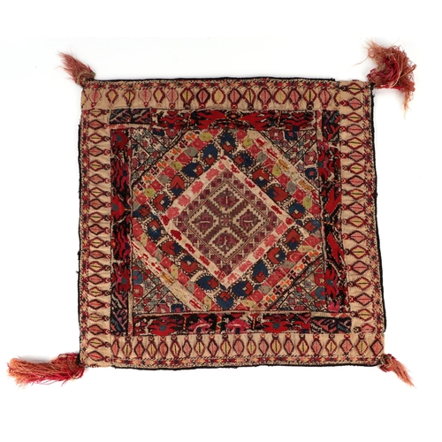 85 - An Islamic / Middle Eastern cotton and silk square textile of geometric repeating design within a mu... 