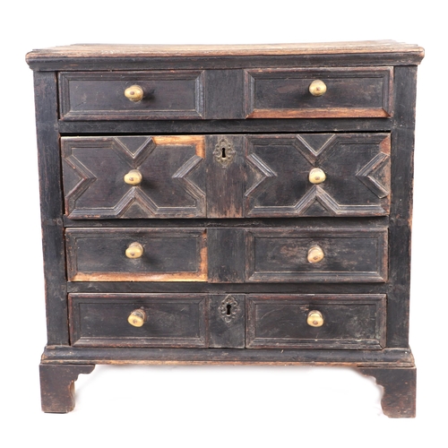 855 - A 19th century oak chest in the 17th century taste with moulded front drawers, on bracket feet, 78cm... 