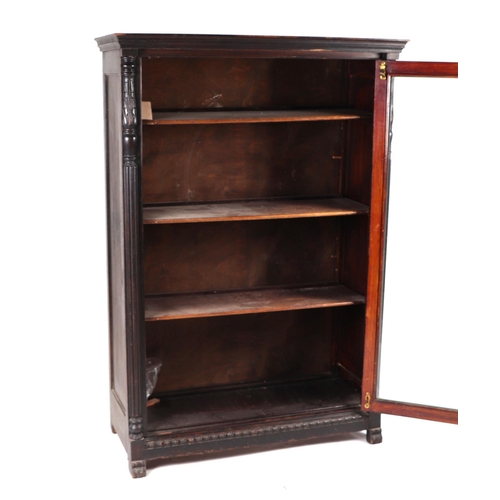 859 - A 19th century mahogany display cabinet, the single glazed panel door enclosing a shelved interior f... 