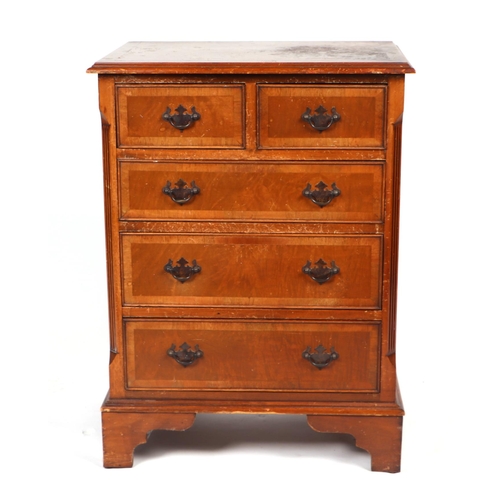 864 - A reproduction George III style burr walnut chest of small proportions, of two short and three long ... 