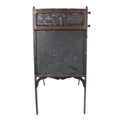 873 - A carved oak early 20th century 'A' frame educational desk with drop-down writing slope and adjustab... 