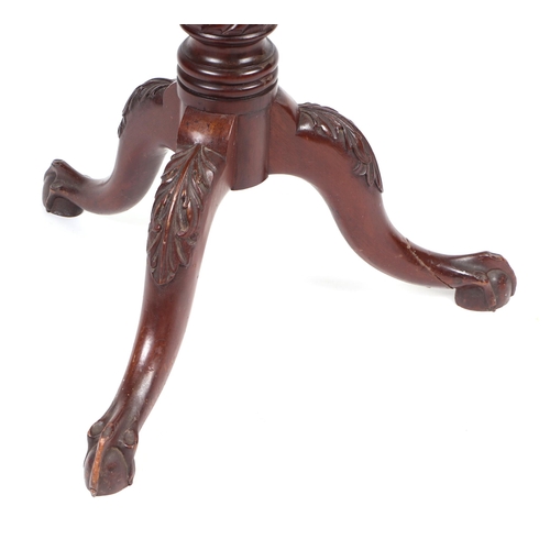 881 - A Victorian mahogany torchere on turned column and tripod base with ball & claw feet, 141cms high.