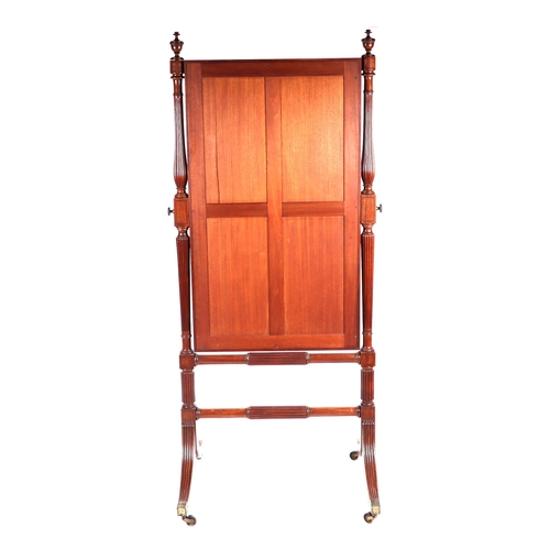 882 - A 19th century mahogany Cheval mirror on turned reeded columns and splay supports, 77cms wide.