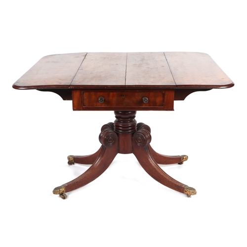 892 - A 19th century mahogany pedestal drop-leaf table on turned column and quatrefoil base, 93cms wide.