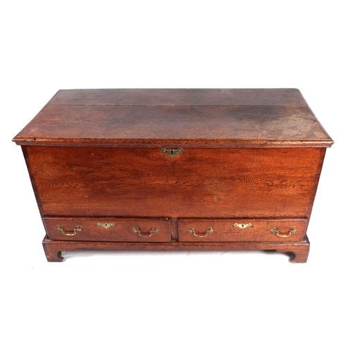 894 - A late 18th / early 19th century oak mule chest with two drawers, on bracket feet, 125cms wide.