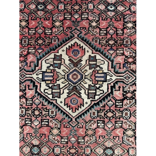 98 - A Persian hand knotted Hamadan runner with repeat floral Mina Khani design and central ivory medalli... 